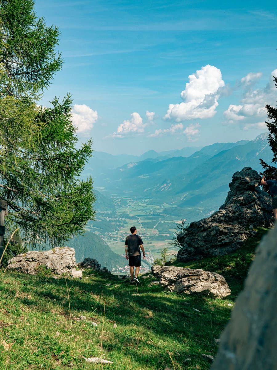 Looking out over green mountains and a lake