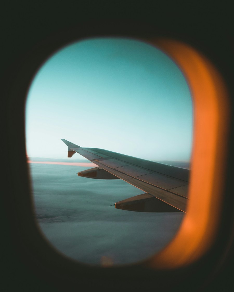 A plane wing seen through the window