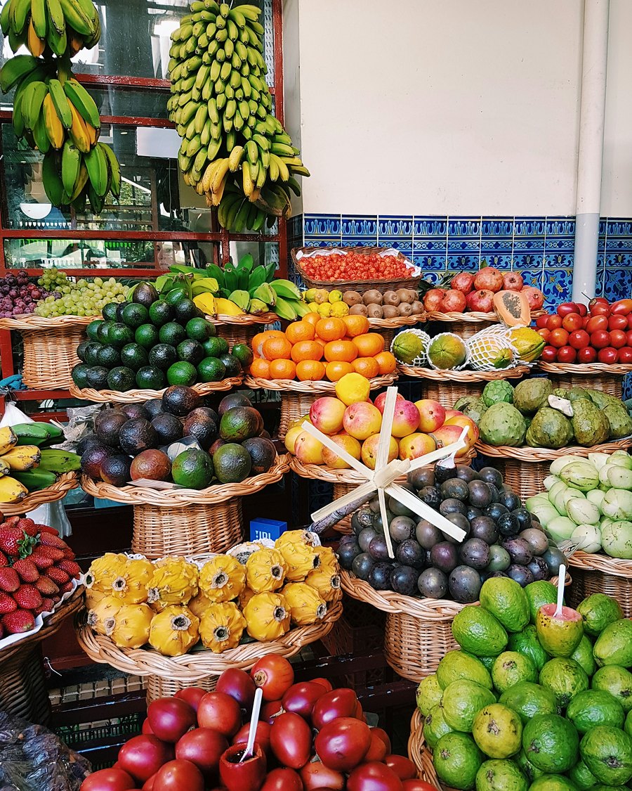 A market stall piled with colourful fruit